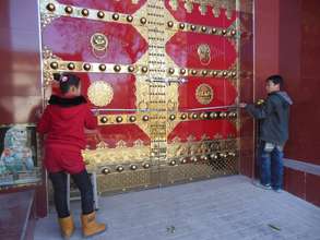 Students work together to measure the door.