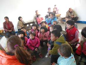 Rural parents and children gather for story time.