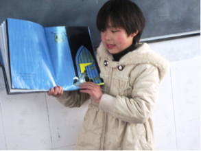 Yiling Reading in front of the class.