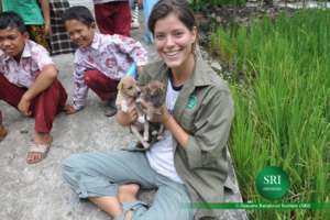 Vet nurse Kate with young puppies