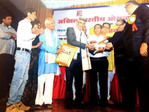 Receiving award from Akhil Bhartiya Oswal Parishad