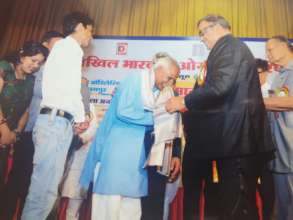 Receiving award from Akhil Bhartiya Oswal Parishad