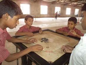 Playing Carrom Board