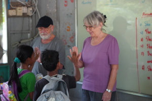 Teachers Hugh and Wendy saying goodbye