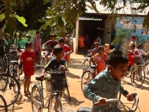 Receiving their brand new bicycles.