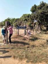 Prasat Char villagers helping to build our fence