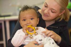 A young patient has fun in group music therapy.