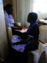 Teddy talks with breastfeeding client before COVID