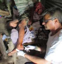 RMF officer cleaning wound on Mr. Krishna Bahadur