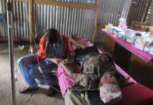 Nurse Binita treating Bhakta Bahadur Surkheti