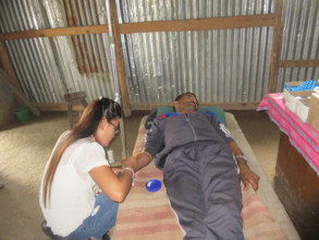 RMF Nurse inserts an IV to administer antibiotics