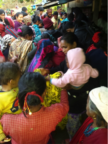 Earthquake affected people receiving warm clothes