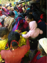 Earthquake affected people receiving warm clothes