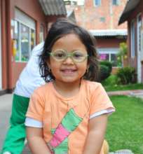 Happy girl with her new glasses