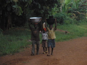 People carrying water from the local water pump