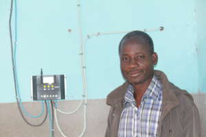 Primary School Principal w/ new solar energy box
