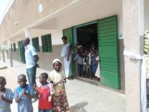 Teacher and students exiting classroom