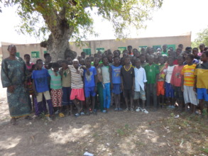 Mrs Zongo, a 5th grade teacher with her students