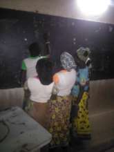 Girls studying at night, Djomga primary school