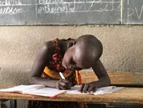 Kamsi Student Working in Classroom w/ Solar Lights
