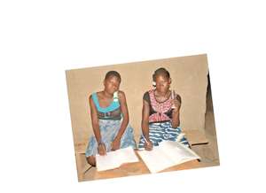 Burkina Faso school girls studying with flashlight