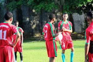 Students playing football in Limon
