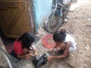 Esha and her friend are getting ready to play marb