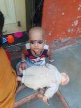 Young Soni plays with her favourite doll