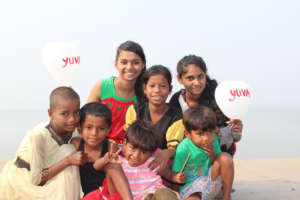 Youth and children holding balloons for awareness