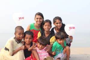 Youth and children holding balloons for awareness