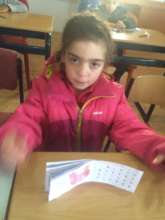 Alexandra, with a booklet donated by FAST
