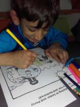 Marius concentrating on his colouring