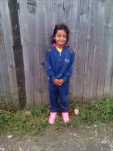 Mirabela with new shoes and warm clothes