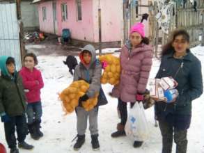 Distributing food to the families in the snow