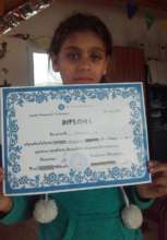 Gabriela with her certificate from school