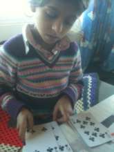 Gabriela improving her maths through a card game