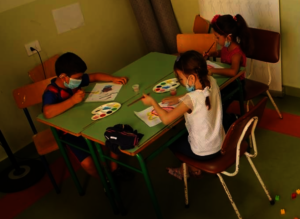 Children painting in the art class