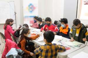 Children drawing at the arts and crafts class