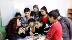 KinderGarden children around their teacher Lilas