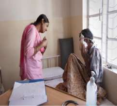Doctor with patient at hospice