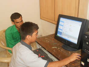 Harshit learning to use the computer.JPG
