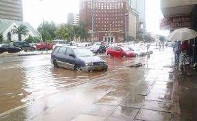 effects blocked drain by litter in Harare CBD
