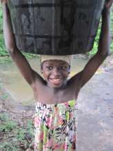 young girl collecting water