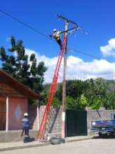 Electricians work on distribution line