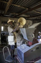 Feeding corn into the new electric mill!