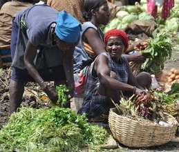 Woman selling her harvest in the local market