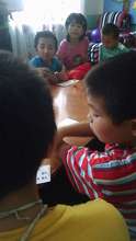The kids play with their new game