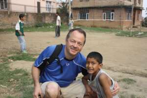 Young Santosh with longtime supporter, Dave Carey