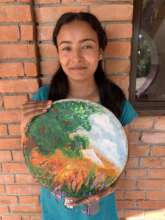 Sangita with artwork she donated to our auction