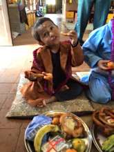Badi Ram enjoys his treats at Ma Pujha